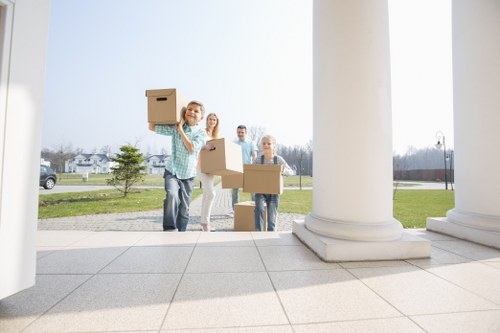 Loading furniture and boxes into a moving van in Woodlands