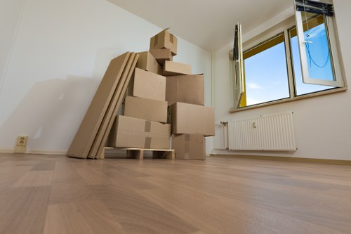 Removalist truck and moving boxes in a Woodlands residential street