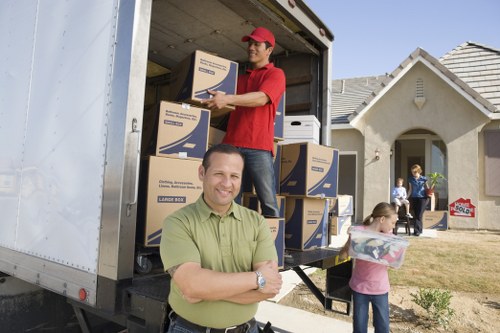 Local movers loading furniture into a truck in Woodlands