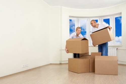A van service handling a flat move with careful lifting and loading