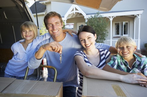 Local house moving team handling furniture outside a Woodlands home
