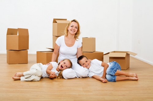 Local van removal team handling household items during a move in Woodlands