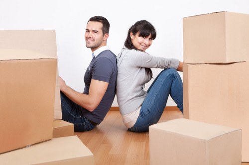 Loading boxes and furniture into a removals van