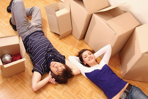 Local packing team handling fragile household items during a move in Woodlands