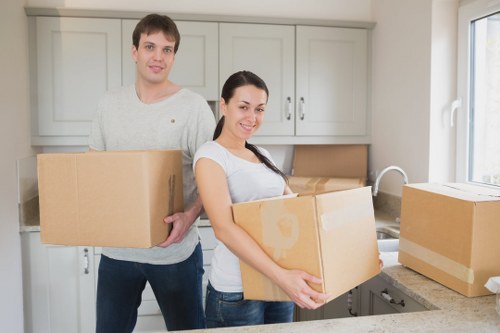 Movers loading furniture into a truck for a Woodlands home move